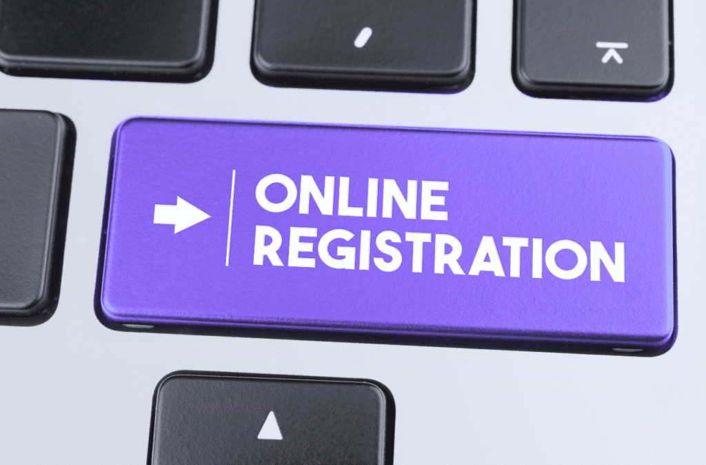 Close-up of a glowing 'Online Registration' key on a modern keyboard, symbolizing fast digital company formation in Estonia.