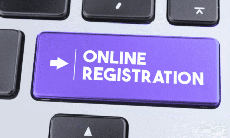 Close-up of a glowing 'Online Registration' key on a modern keyboard, symbolizing fast digital company formation in Estonia.